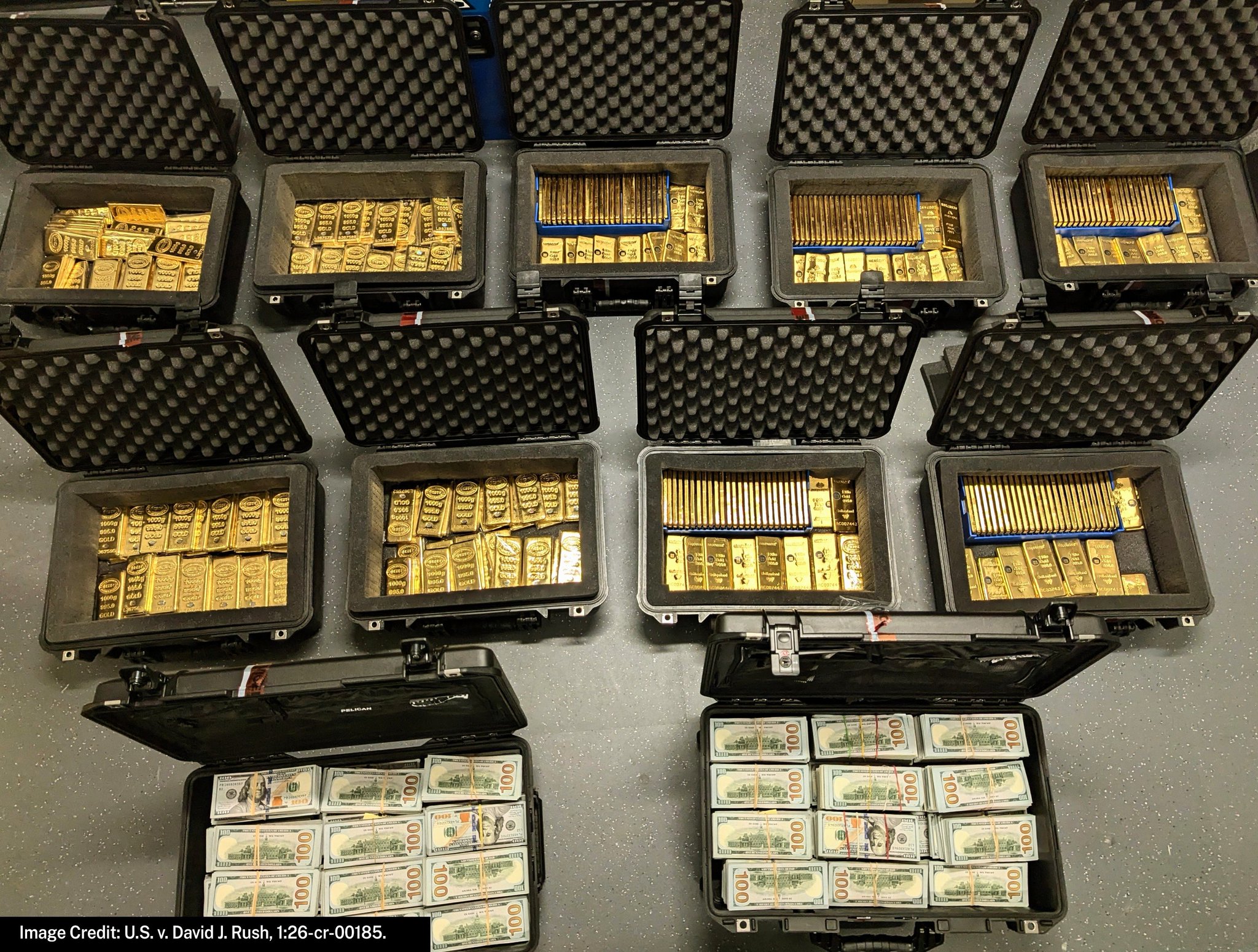 Seized vault contents — gold bars and cash in cases (public court exhibit)